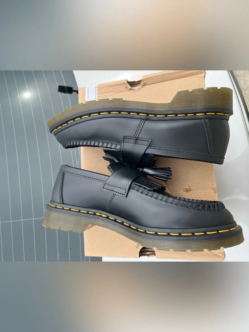 Dr. Martens Black Tassel Kiltie Loafers with Yellow Stitching